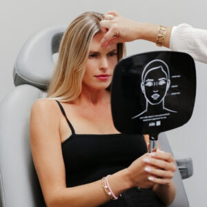 injectables-11-eleven-lines-woman-in-chair-botox-at-natural-body-spa-med-spa-atlanta-276x276