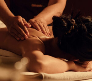 woman-receiving-shoulder-back-massage-deep-tissue-swedish-at-natural-body-spa-med-spa-atlanta-767x670