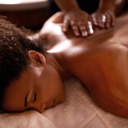 Woman lying face down receiving a Swedish or Deep Tissue massage at Natural Body Spa + Med Spa in Atlanta.