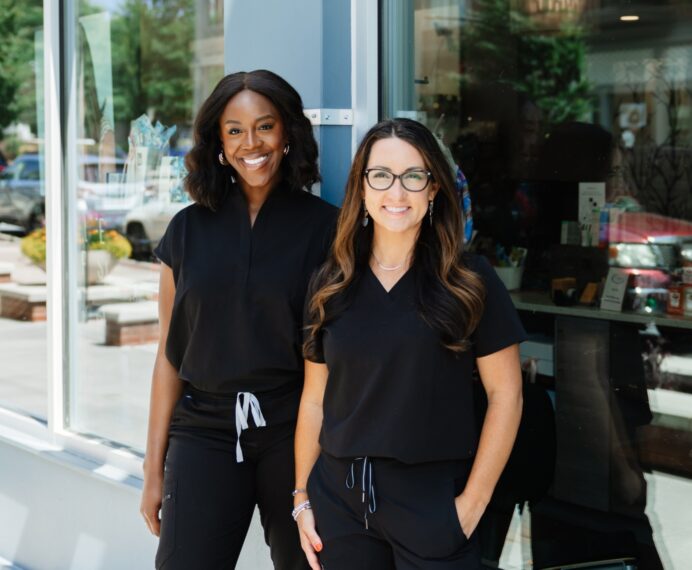 Two aesthetic injectors standing in front of Natural Body in Atlanta, GA