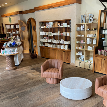 Brookhaven's interior has products available for sale and comfortable seating at Natural Body in Atlanta