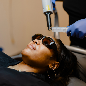A woman receiving an Erbium-skin-resurfacing-laser treatment at Natural Body Day Spa + Med Spa in Atlanta, GA