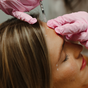 A woman in a treatment chair at Natural Body Spa and Med Spa receiving a Botox treatment in Atlanta, GA