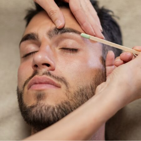 Man receiving a waxing + grooming service at at Natural Body Spa + Med Spa in Atlanta
