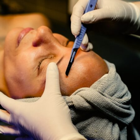 woman receiving dermaplaning facial at Natural Body Spa + Med Spa in Atlanta, GA