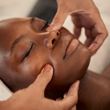 woman laying on a table receiving a spa facial at Natural Body Spa + Med Spa in Atlanta, GA