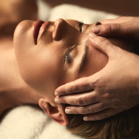 woman laying face up receiving a facial at Natural Body Spa + Med Spa in Atlanta, GA