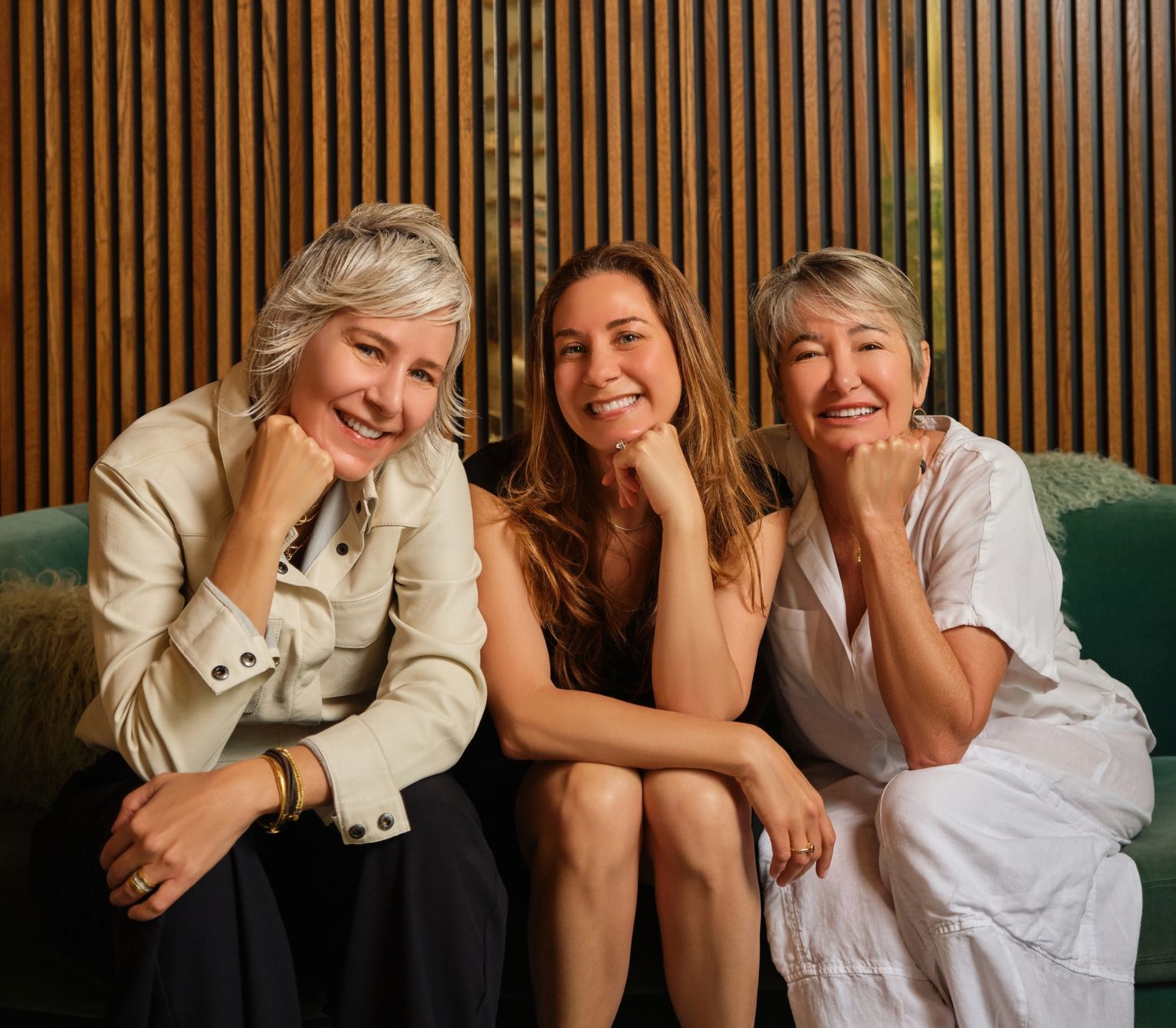 Viva Day Spa and Natural Body Spa founders sitting on couch